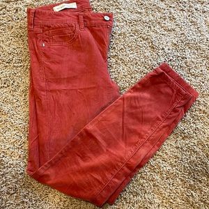 Rust corduroy jeans.